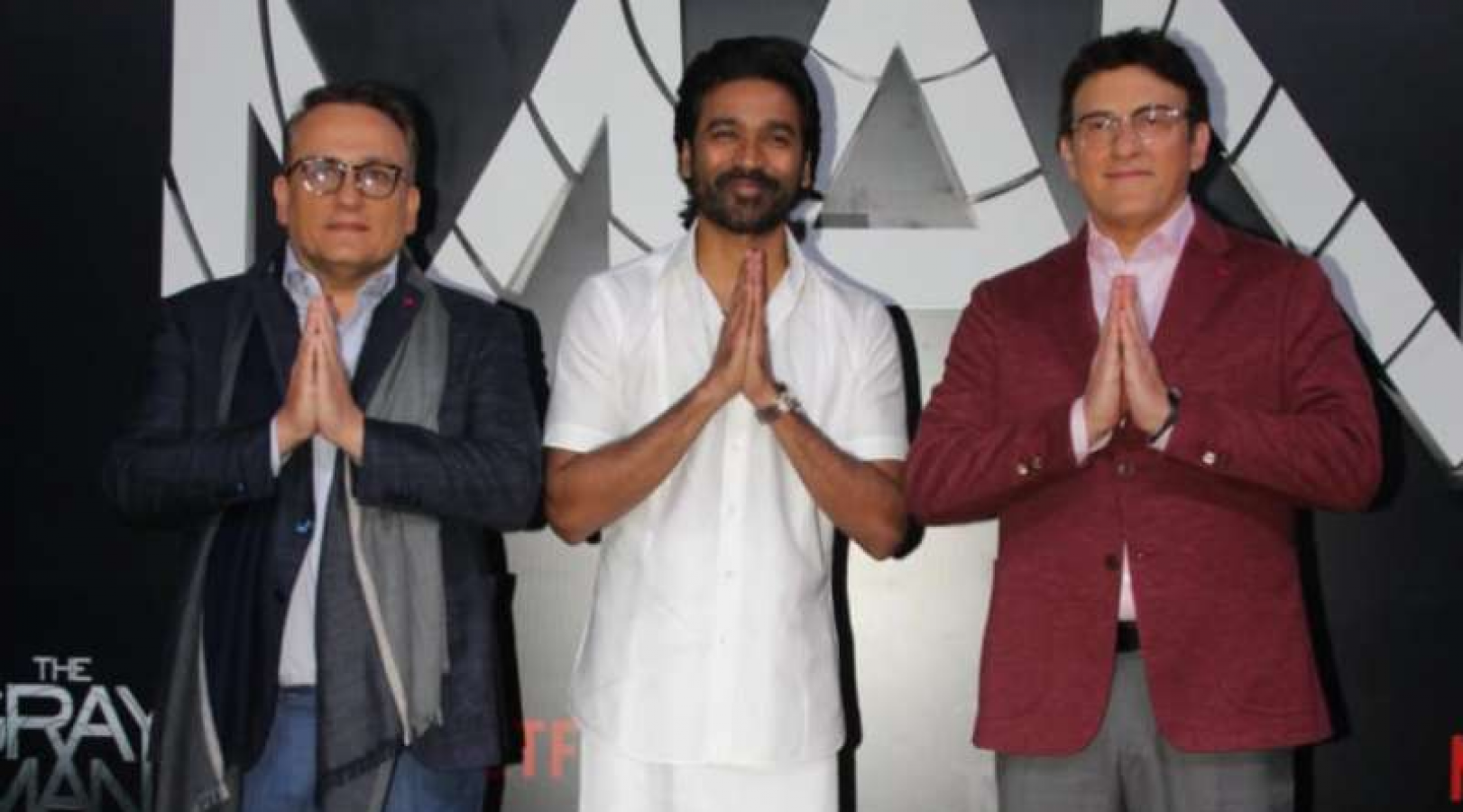 Dhanush attends The Gray Man premiere with sons Linga, Yathra. See