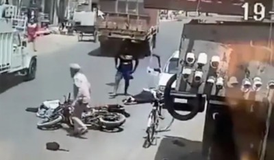 Watch: In a horrifying accident, Motorcyclist crashes through vehicle door, rams into truck