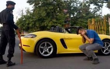 Porsche rider made to do situps for violating lockdown rules