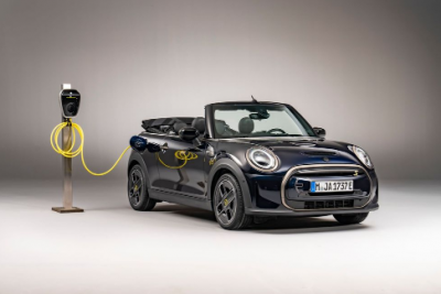 The limited-edition EV MINI Cooper SE Convertible emerges from concealing
