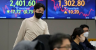 Asian shares decline as positive data dampen expectations for a dove Fed
