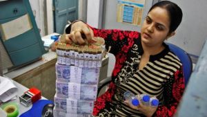 Rupee jumps 15 paise against dollar to 64.39