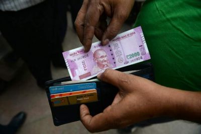 Indian Currency firms up 8 paise against USD at 64.35