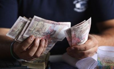Indian Currency slip 7 paise to 64.35 against USD