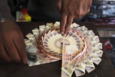 Rupee weakened by 5 paise to trade at 64.39 against USD