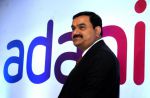 Adani Group’s 3 entities pledge more shares for SBI