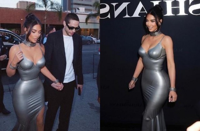Kim is seen holding boyfriend's hand in silver Thai-slit dress