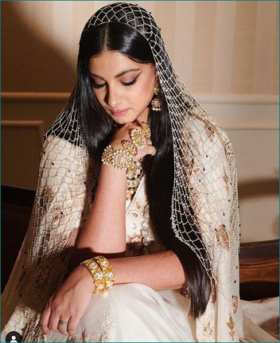 Rhea Kapoor wears an ivory-gold work saree at her wedding