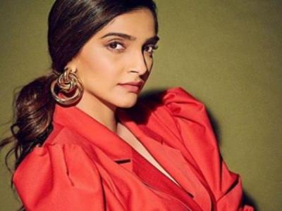 Sonam Kapoor looks stunning in this vintage red pantsuit, check it out here