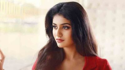 Wink girl Priya Prakash Varrier shares  red outfit pics from her latest photoshoot