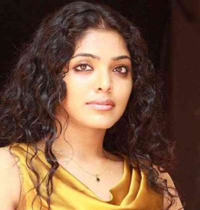 Rima Kallingal asks fans to spot her in a throwback picture
