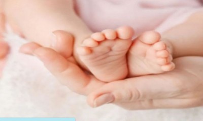 woman gave birth to a child with four arms and legs