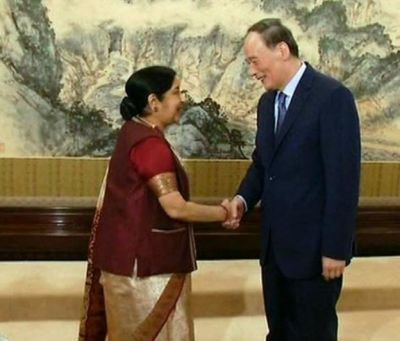 Swaraj accords hands with Chinese Vice President Wang Qishan