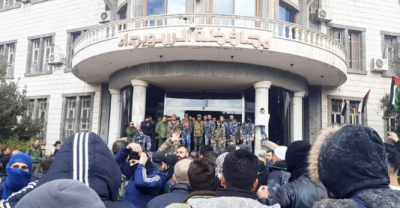 Demonstrators storm the governor's office in southern Syria, killing two people