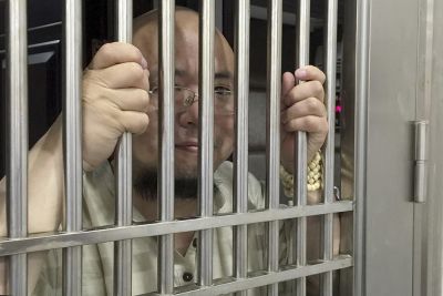 Human rights activist gets eight years Human rights activist gets eight years behind the bars: China: China