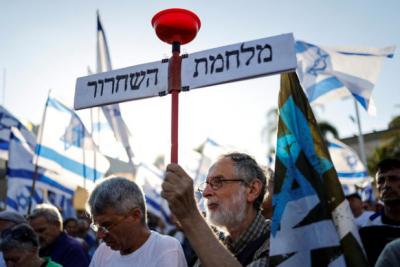 Israeli lawmakers draft a contentious bill for final votes amidst protests