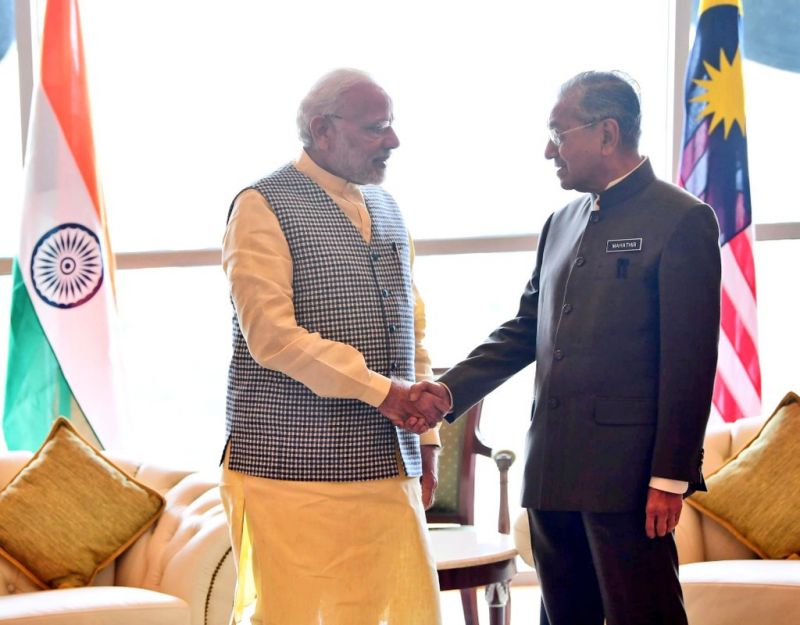 Three-nation visit: PM Modi calls  Dr. Mahathir Mohamad