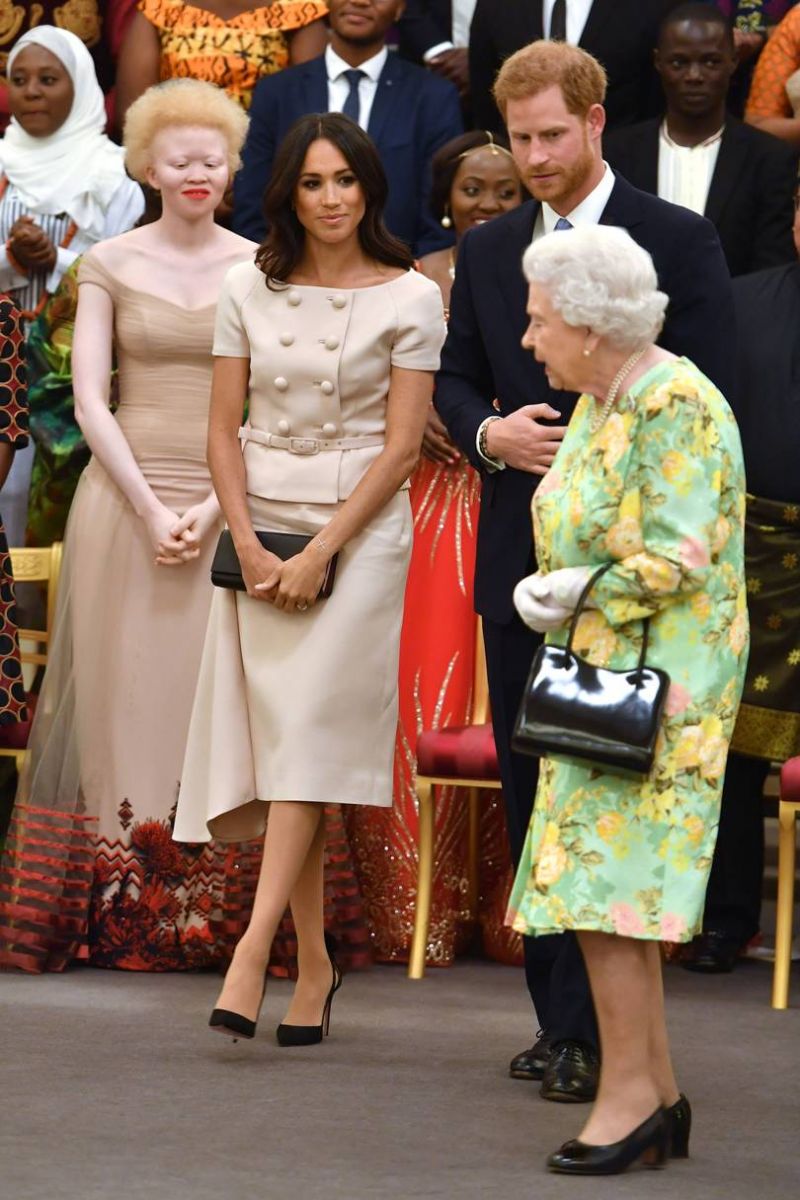 Meghan sports a blush Prada suit at the Queen’s Young Leaders Awards