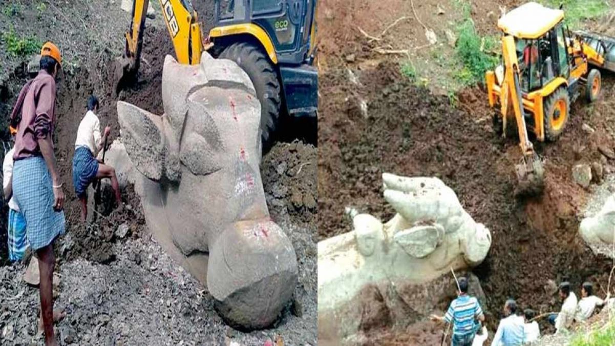 Mysore: Statue of ancient Lord Shiva's vehicle Nandi found in an excavation of dry lake, the crowd gathered