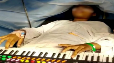 Doctor performs successful brain tumor operation of child playing piano, video goes viral