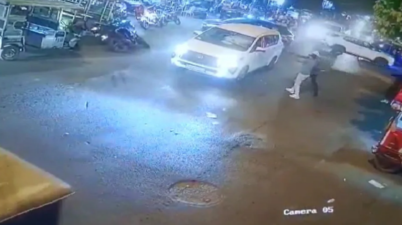 Miscreants openly fired at car, stampede on road