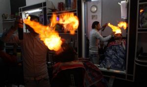 Video: Palestinian barber uses fire instead of a hair Dryer
