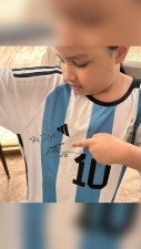 Ziva wears Messi's autographed T-shirt