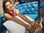 Another wedding bell;See the pictures of Sambhavna Seth's mehendi ceremony