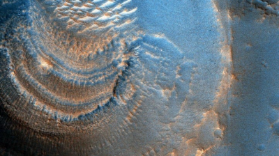 Photographs taken by NASA's Mars Reconnaissance Orbiter reveal mysterious crater deposits