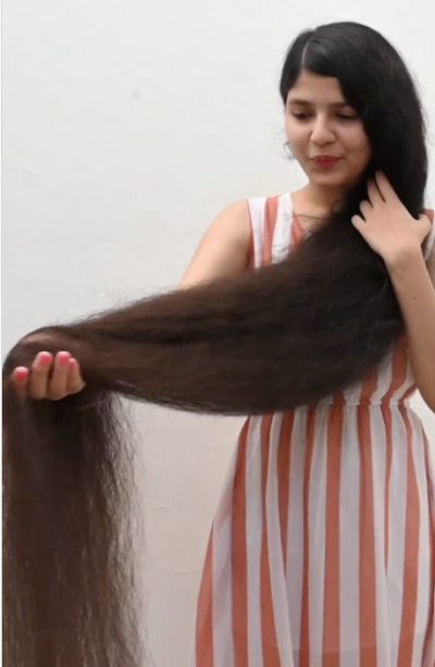 World's tallest hair girl cuts off her hair