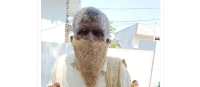 Young man wearing bird-nest as a mask, photo going viral