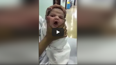 Video : नन्हे बच्चे के मुँह को मरोड़ रही नर्स, पड़ी जमकर गालियां