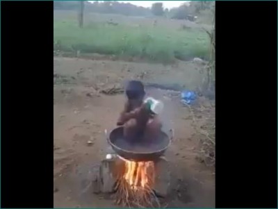 Child taking unique bath during severe cold, Watch video
