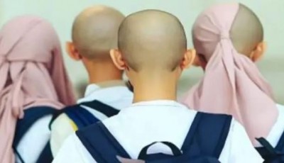 सही तरीके से नहीं पहना हिजाब, तो शिक्षक ने 14 छात्राओं को कर दिया गंजा